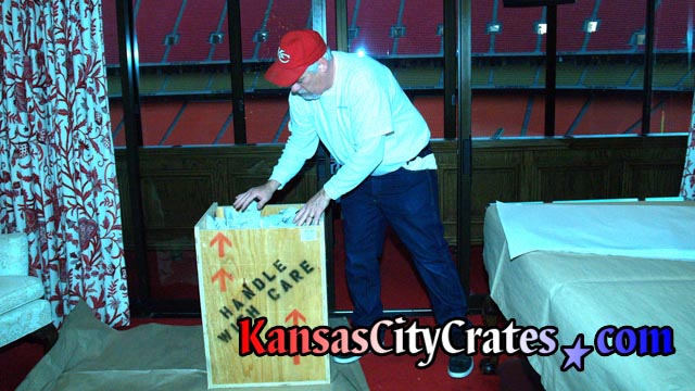 Packing indestructible box crate for private collector at football stadium
