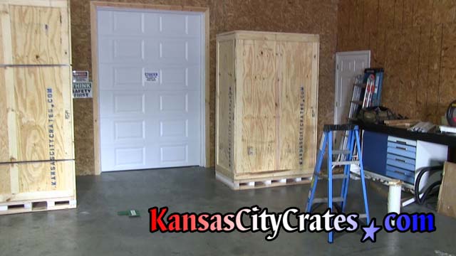 Two commercial crates made of 1 by 4 frames with 3/8 plywood sheathing