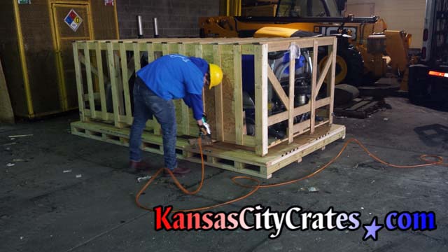 Industrial pallet under large crate fastened with ringshank nailer