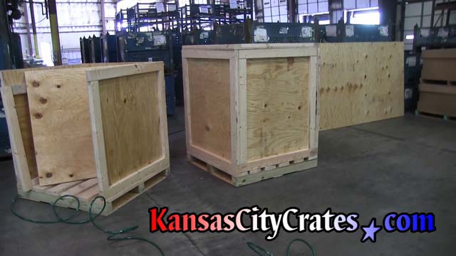 Two industrial crates on pallet bases to load machinery parts for shipping