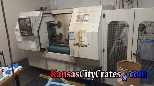 Industrial lathe at aerospace manufactoring facility is prepared for HD Industrial Crating