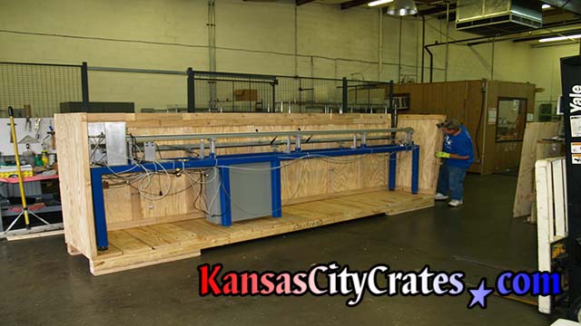Crate builder assembles large industrial crate with pneumatic ringshank nailer