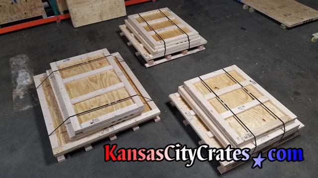 Three knock down style crates steel banded for delivery