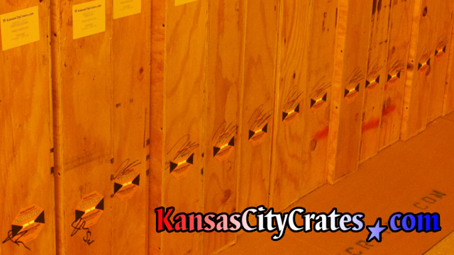 Job site photo of impact indicators affixed to crates that monitor handling while in the chain of custody during transit.