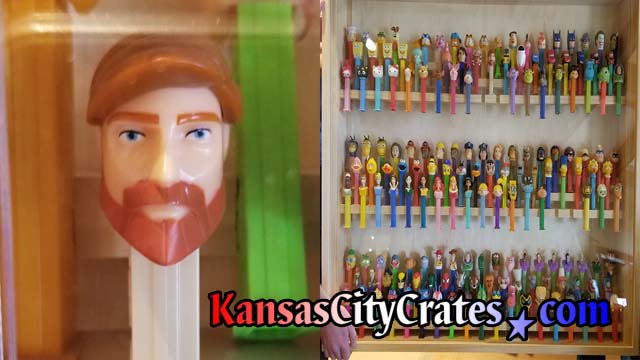 Collection of 180 Pez dispensers in wood display case