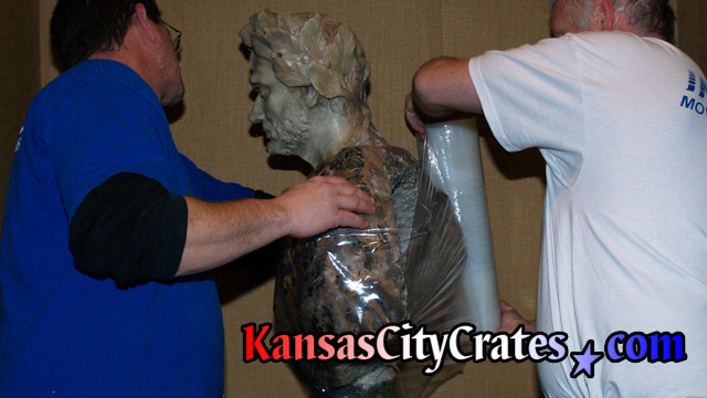 Stretch wrapping marble bust sculpture for indextructible box crate at mansion in Kansas City MO  64129