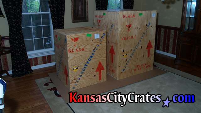Solid wall vault crates on flooring protection in mansion before shipping.