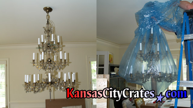 Two views of 30 arm alrge chandelier getting bagged for crating at home in Smithville MO  64089