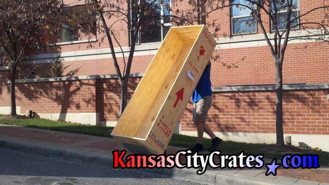 Removing wood box crate from residence after local move at home in Kansas City MO  64112