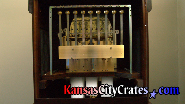 Tubular chimes removed from clock before packing into crate for transport at Kansas City home.