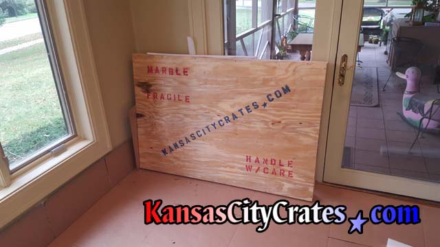 Crate is placed on cardboard ready for loading