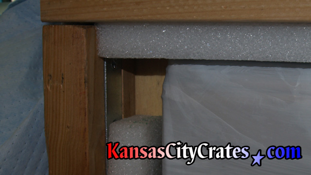 Foam edges of granite top crate protect corners during handling.