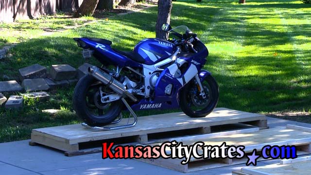 Sport bike loaded onto pallet and sitting on rear stand.