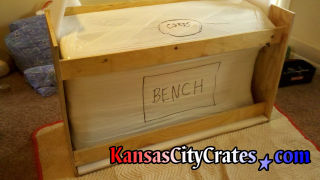 Once stretch wrapped, the piano is marked to help handlers removing from crate to prevent damage.