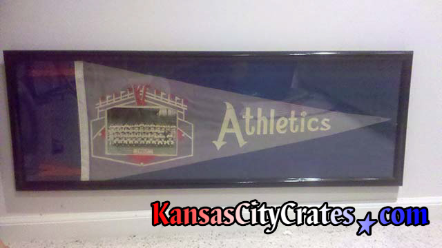 Original Kansas City Athletics Pennant in glass case before crating.