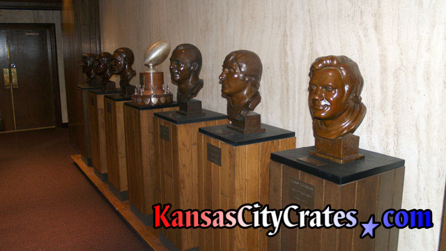 6 football bust sculptures for packing into wood crates.