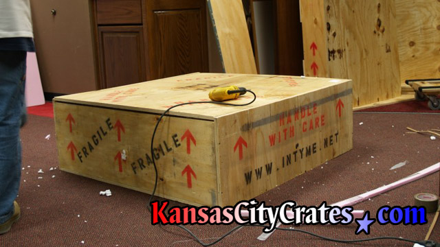 Game play recreation packed into wood crate at visitors are of NFL team office in Kansas CIty.