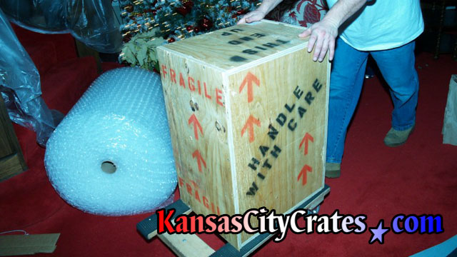 Packing indestructible wood box during Christmas at suite in Arrowhead Stadium