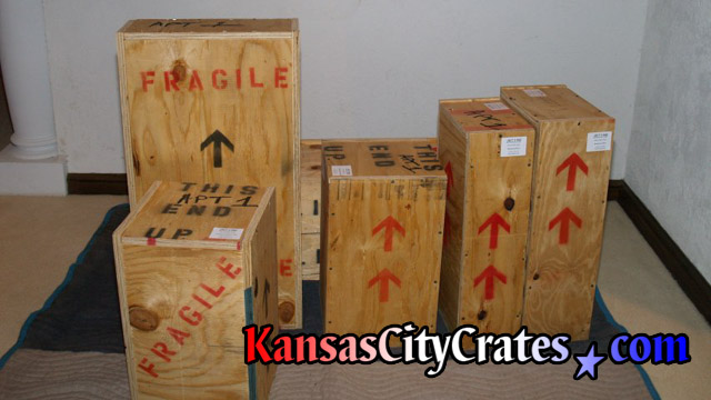 Private art collector crates on flooring protection.