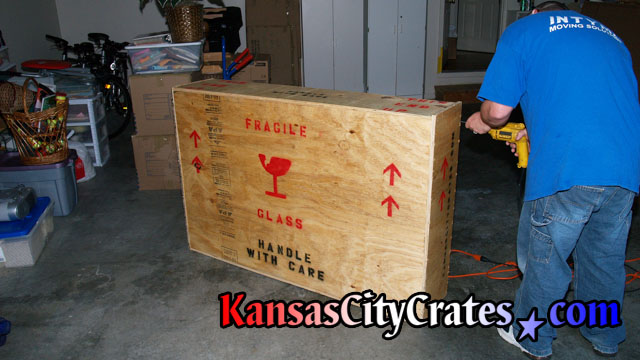 Crater closing crate before adding shipping labels.