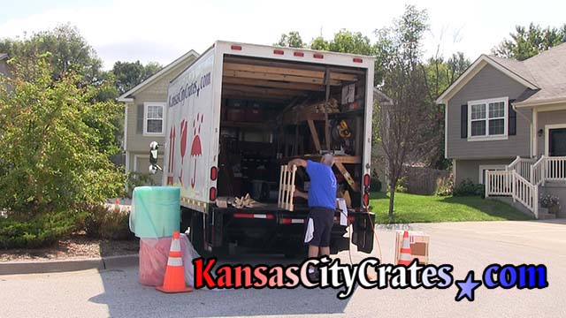 Crate builder assembles wood crate with pneumatic stapler at home in Lee's Summit MO  64063