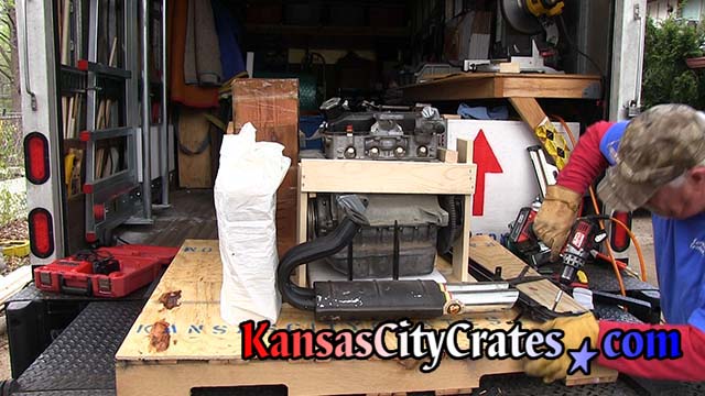 Crate builder assembles frame around motor on pallet