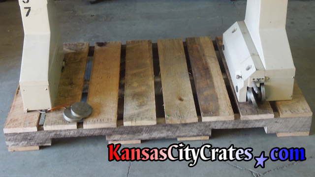 Upper portion of machinery on rough oak ISO pallet.