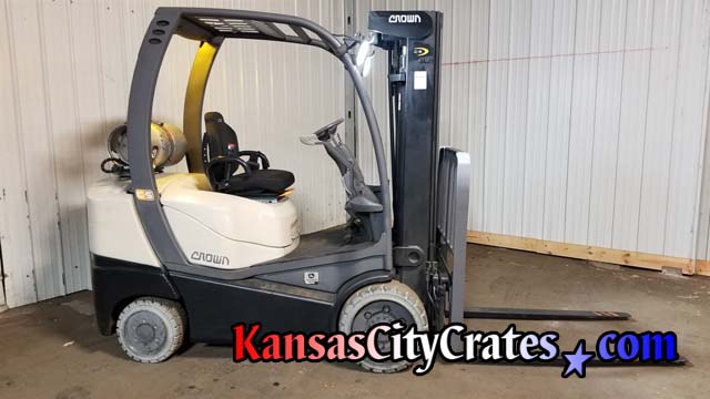 2013 Crown C5 Internal Combustion cushion model forklift powered by John Deere to load crates and unload materials