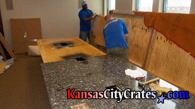 Granite conference table loaded into export crate at law office