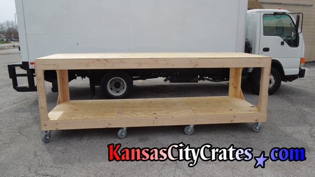 Custom built wood cart to transport materials in an orderly fashion.