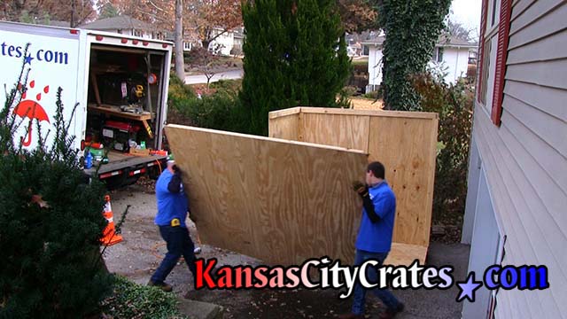 Crate builders carry third wall of Lift Van Type II storage vault
